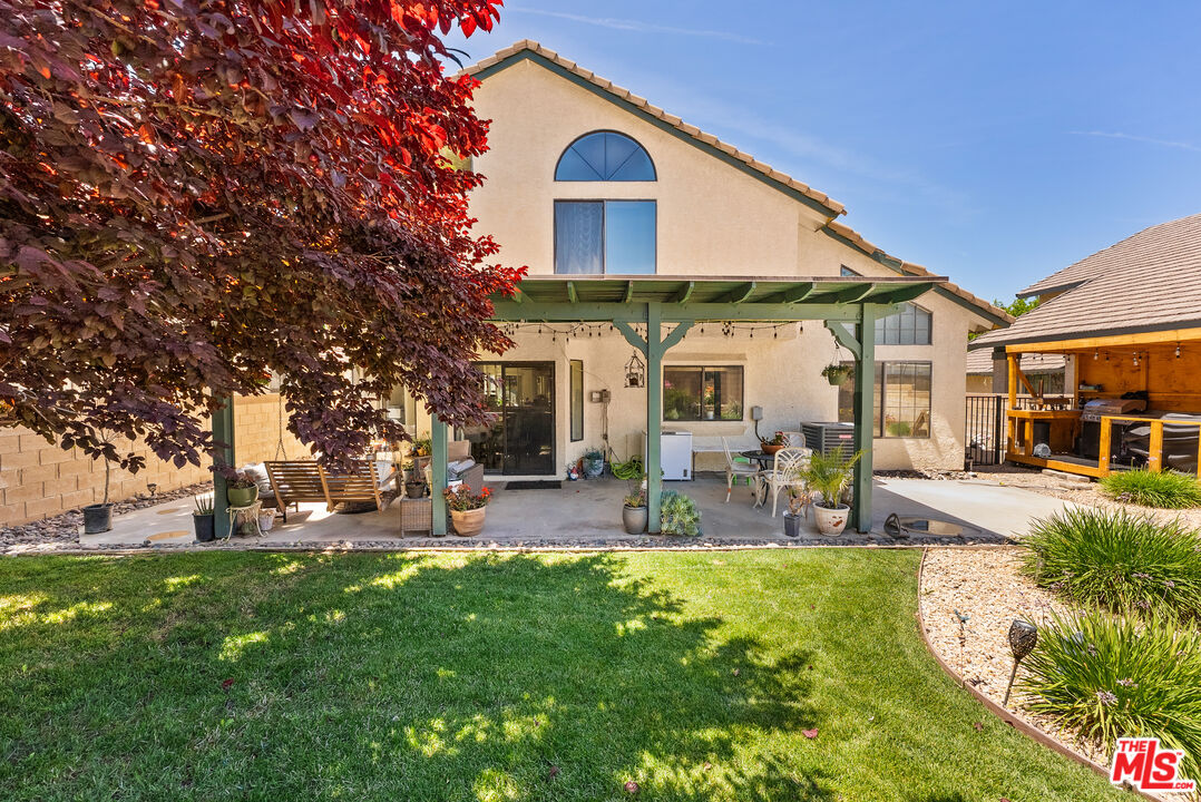 43258 33rd Street West Lancaster, CA 93536 - Photo 33 of 38 a view of a house with backyard and sitting area