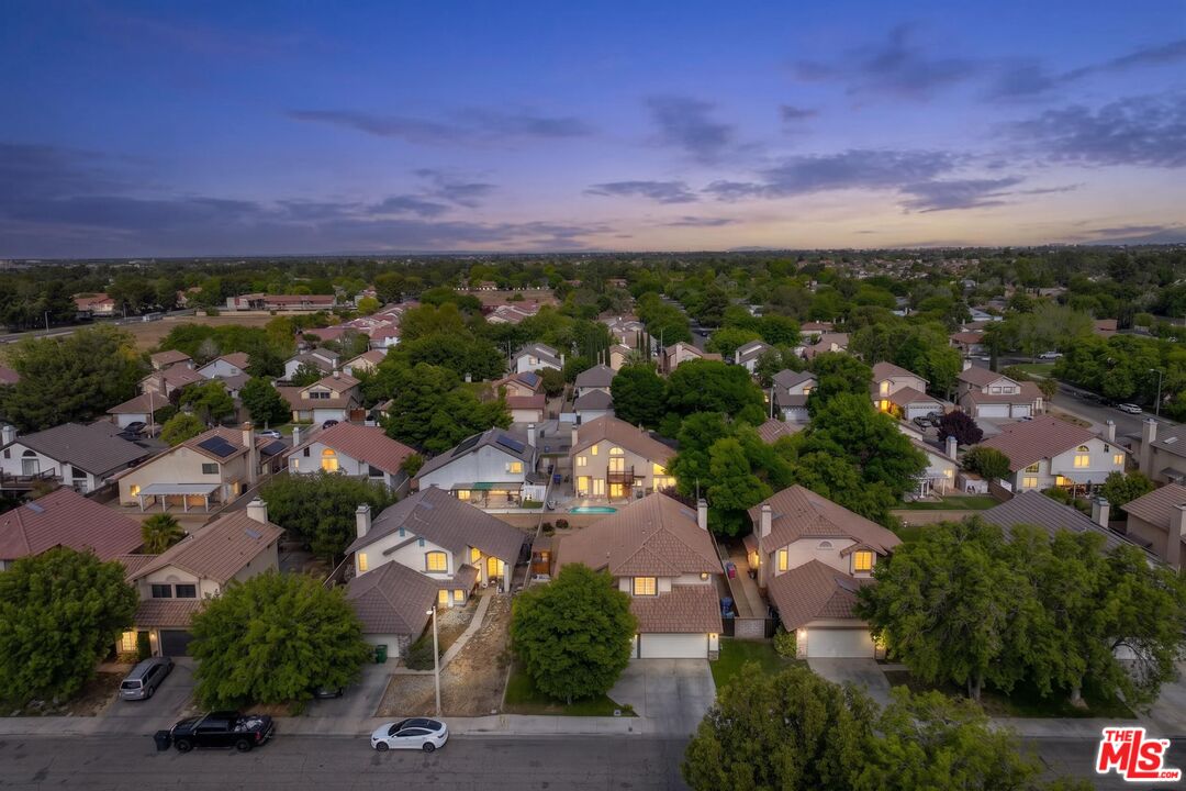 43258 33rd Street West Lancaster, CA 93536 - Photo 38 of 38 an aerial view of a residential houses with outdoor space and street view