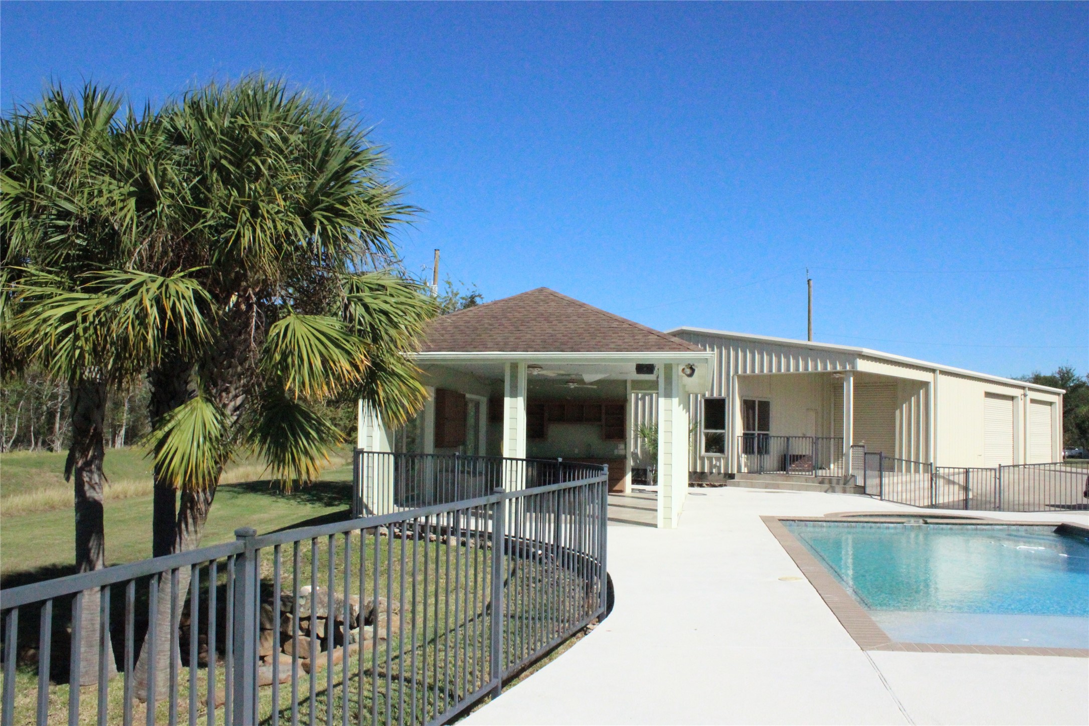 2904 Red Bluff Road Seabrook, TX 77586 - Photo 1 of 16 a view of a house with swimming pool and sitting area