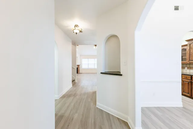 a view of a living room with a wooden floor