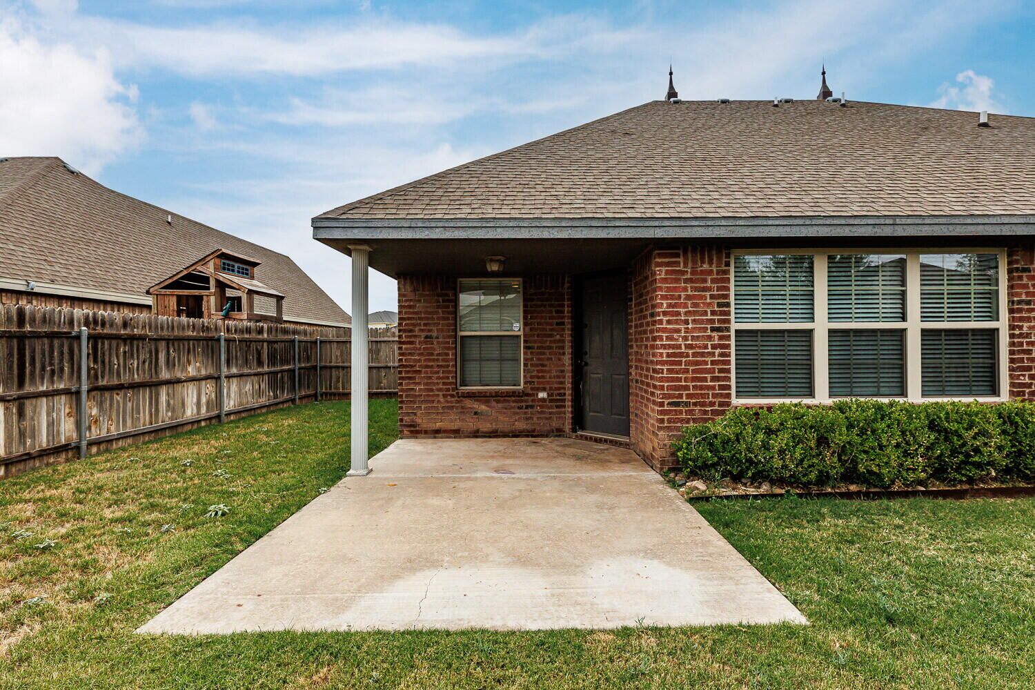 5908 95th Street Lubbock, TX 79424 - Photo 45 of 45 a front view of a house with garden
