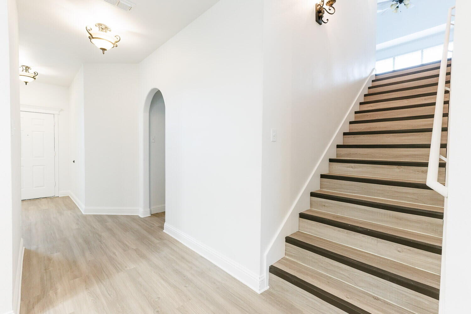 5908 95th Street Lubbock, TX 79424 - Photo 6 of 45 a view of entryway with wooden floor
