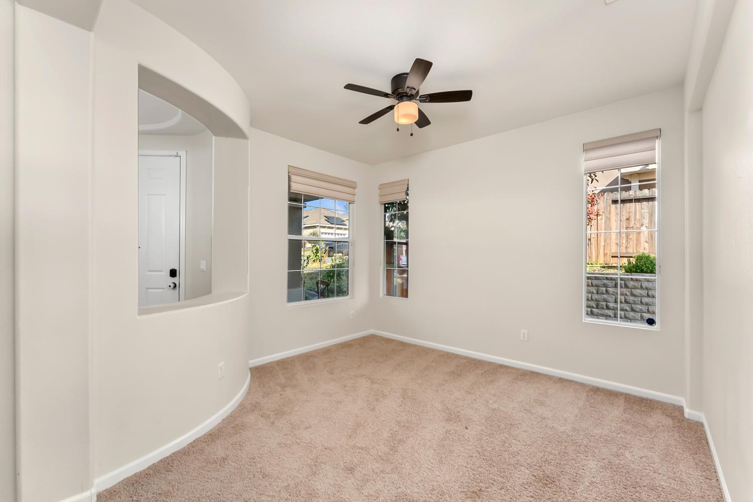 4285 Crazy Horse Road Cameron Park, CA 95682 - Photo 19 of 91 a view of a livingroom with a window and a ceiling fan