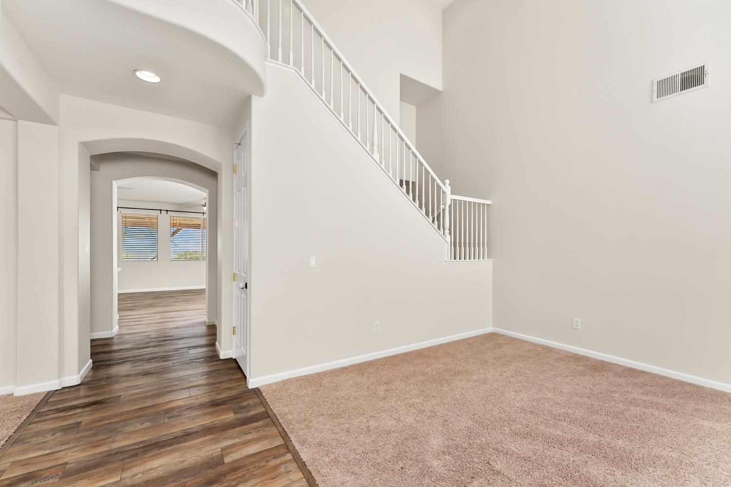 4285 Crazy Horse Road Cameron Park, CA 95682 - Photo 26 of 91 a view of a hallway with wooden floor and entryway