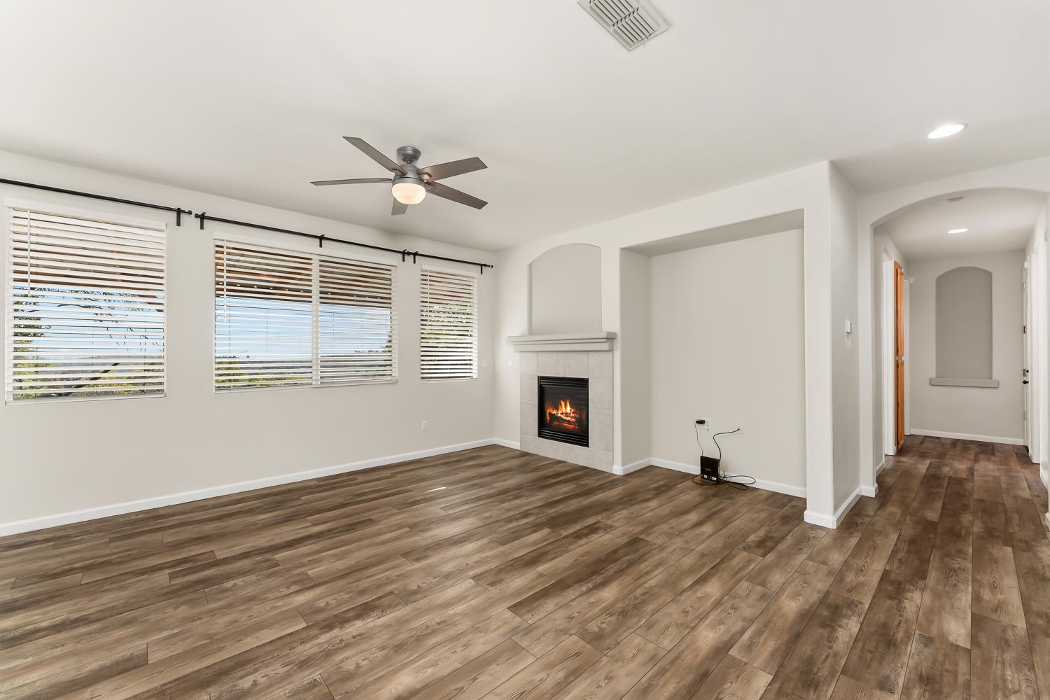 4285 Crazy Horse Road Cameron Park, CA 95682 - Photo 40 of 91 a view of empty room with wooden floor and fan