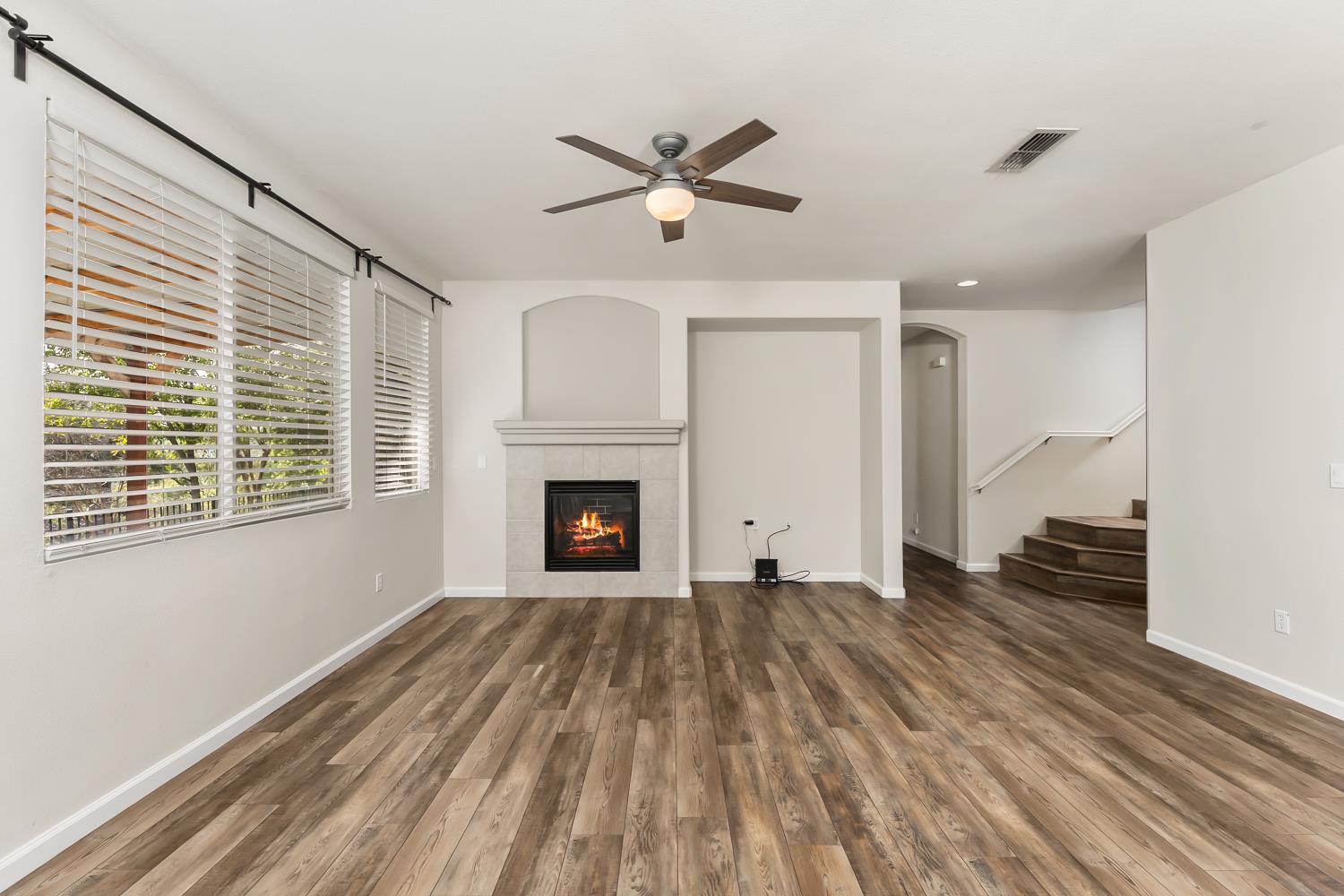 4285 Crazy Horse Road Cameron Park, CA 95682 - Photo 41 of 91 a view of empty room with wooden floor and fan