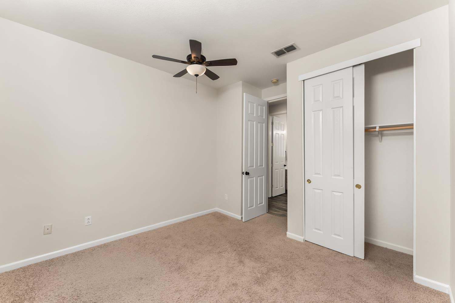 4285 Crazy Horse Road Cameron Park, CA 95682 - Photo 44 of 91 a view of a hallway with a chandelier fan
