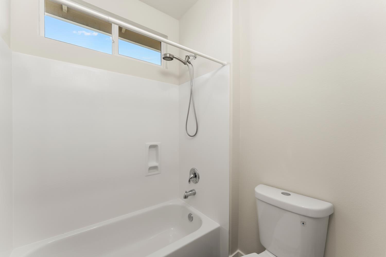 4285 Crazy Horse Road Cameron Park, CA 95682 - Photo 55 of 91 a bathroom with a bath tub and a toilet