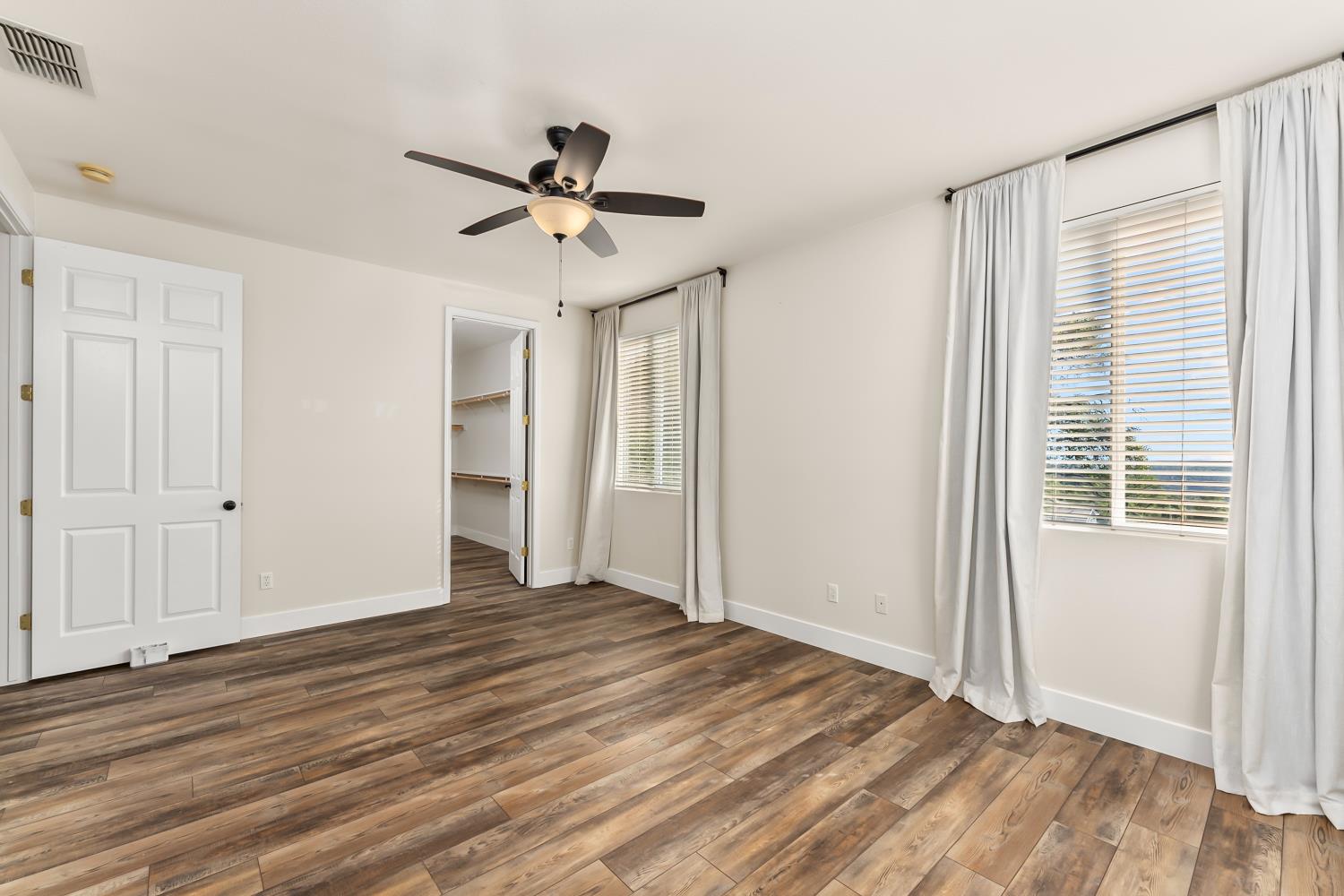 4285 Crazy Horse Road Cameron Park, CA 95682 - Photo 61 of 91 a view of empty room with wooden floor and fan
