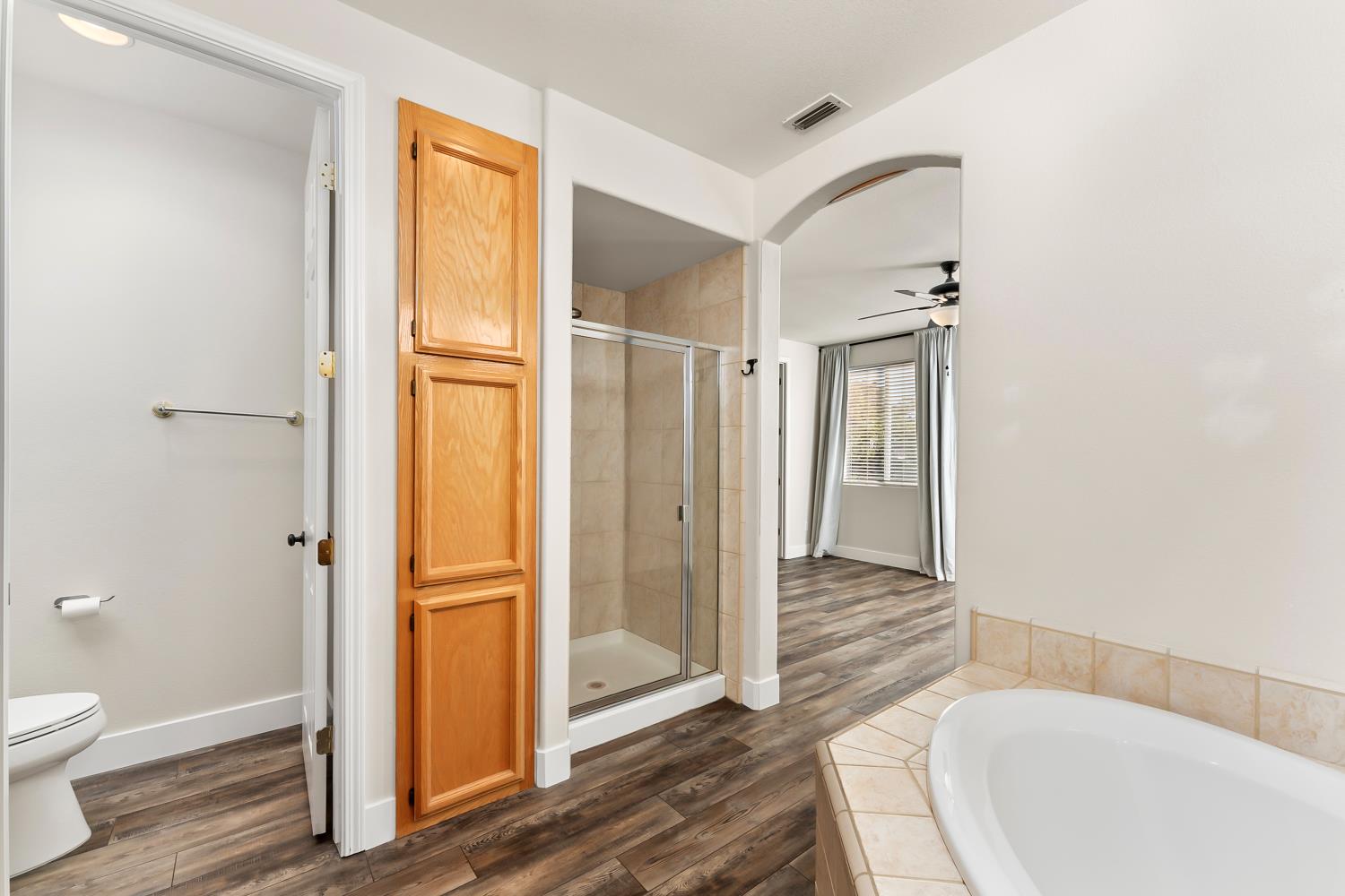 4285 Crazy Horse Road Cameron Park, CA 95682 - Photo 64 of 91 a bathroom with a tub and shower