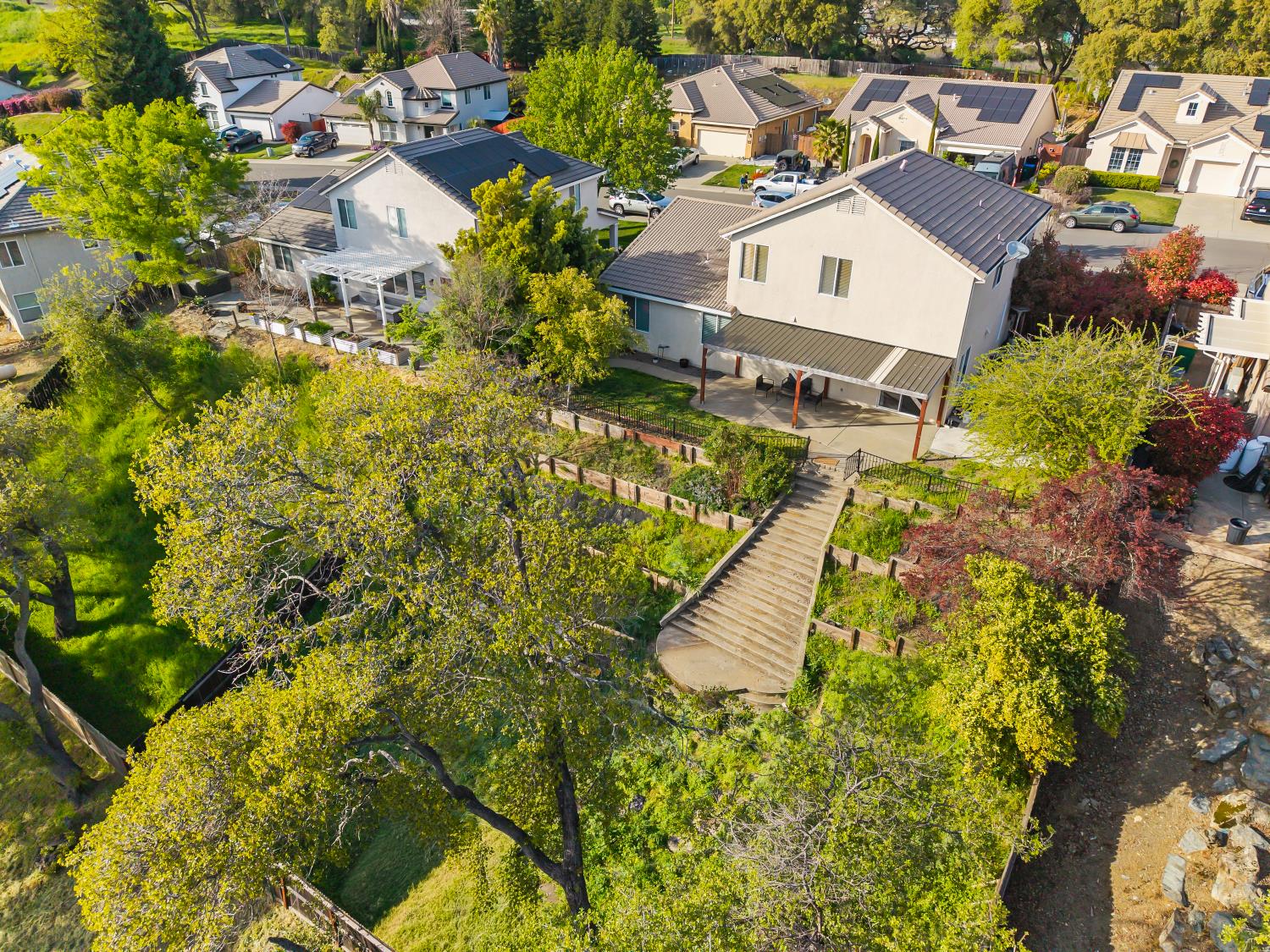4285 Crazy Horse Road Cameron Park, CA 95682 - Photo 87 of 91 an aerial view of residential house with swimming pool and lawn chairs