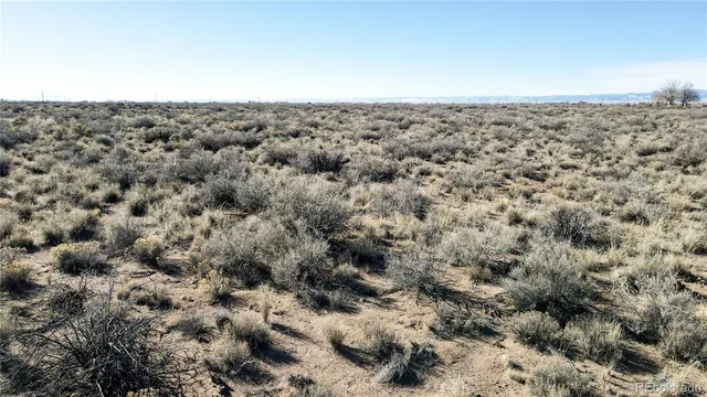 a bathroom with a granite countertop shower and a sink