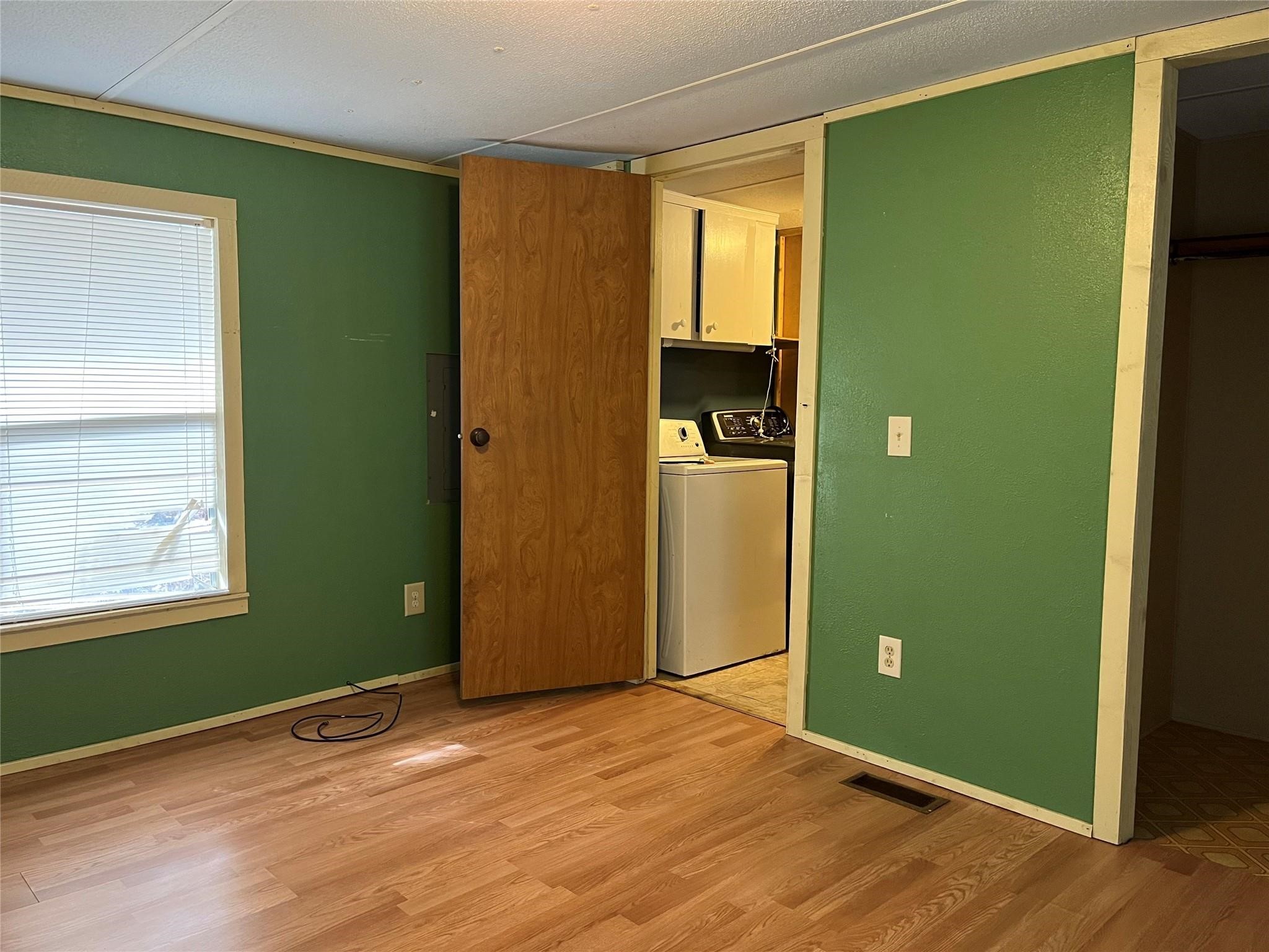 1171 Cardinal Lane Trinity, TX 75862 - Photo 6 of 14 a view of empty room with window and wooden floor