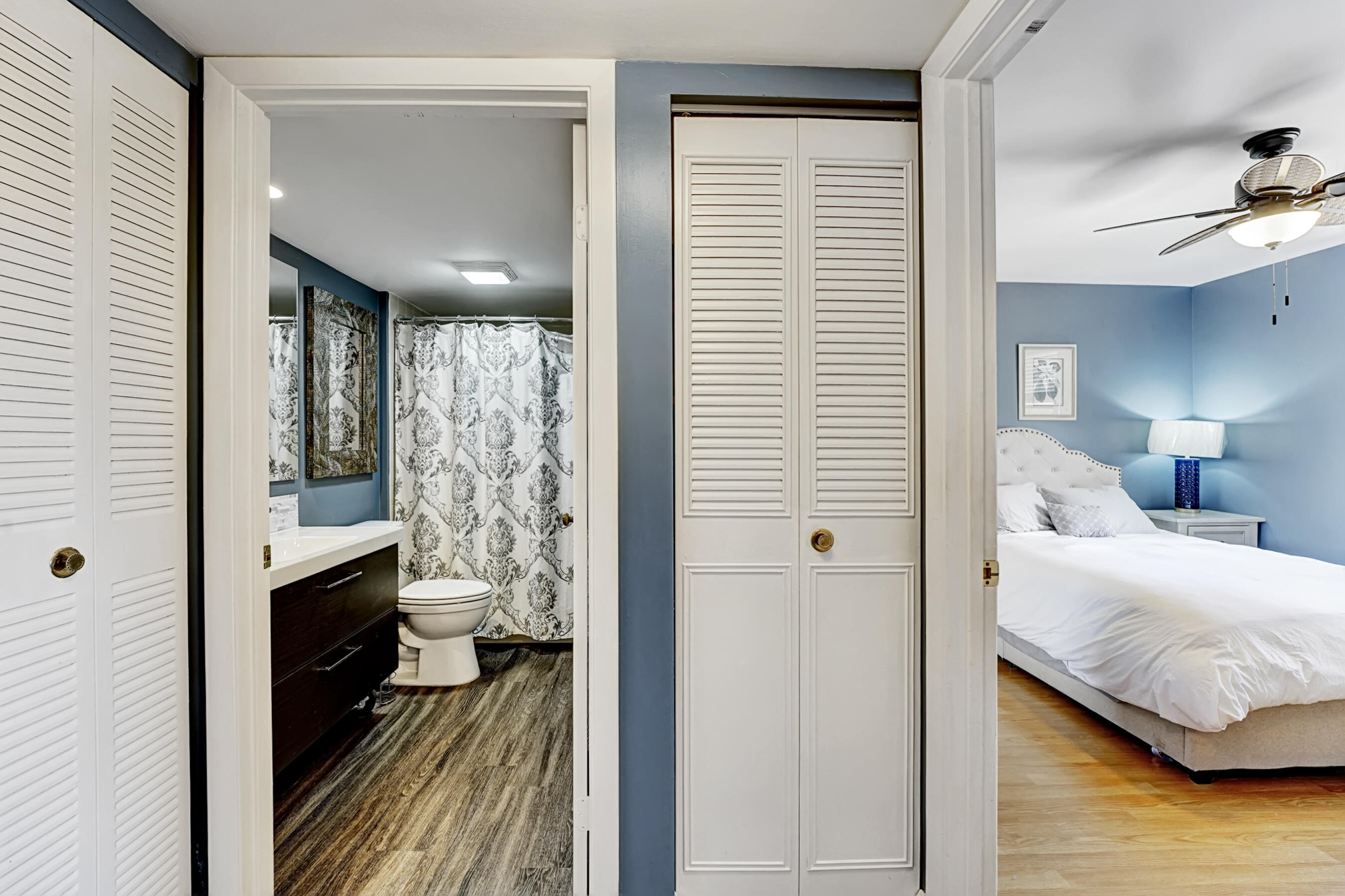 6097 Balboa Circle, Unit 406 Boca Raton, FL 33433 - Photo 15 of 28 a bedroom with a bed closet and a large window