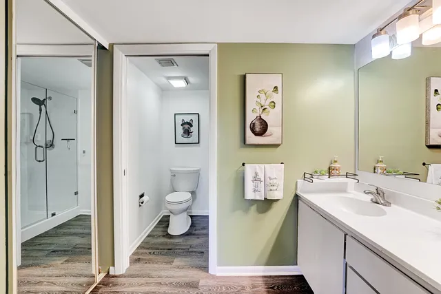 a bathroom with a sink toilet and shower