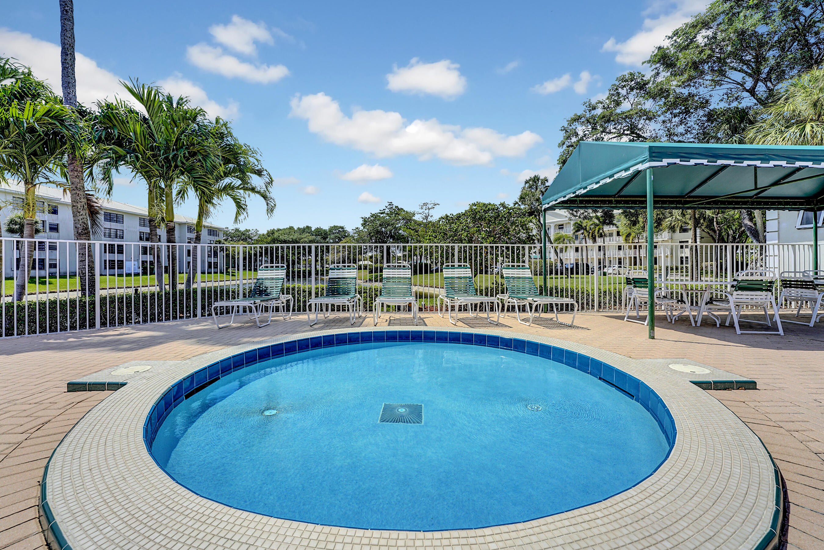 6097 Balboa Circle, Unit 406 Boca Raton, FL 33433 - Photo 28 of 28 a view of outdoor space yard swimming pool and patio