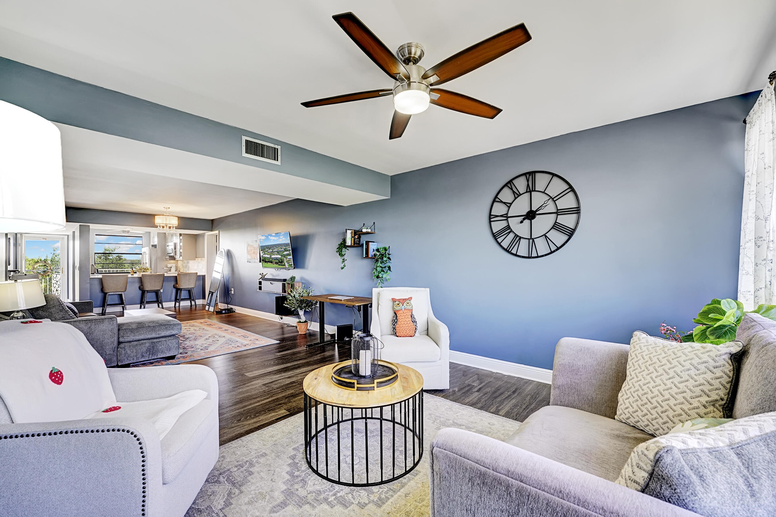 6097 Balboa Circle, Unit 406 Boca Raton, FL 33433 - Photo 8 of 28 a living room with furniture and a large window