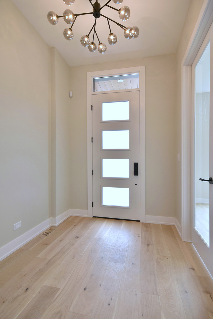 274 North Addison Avenue Elmhurst, IL 60126 - Photo 2 of 57 wooden floor in an empty room with a window