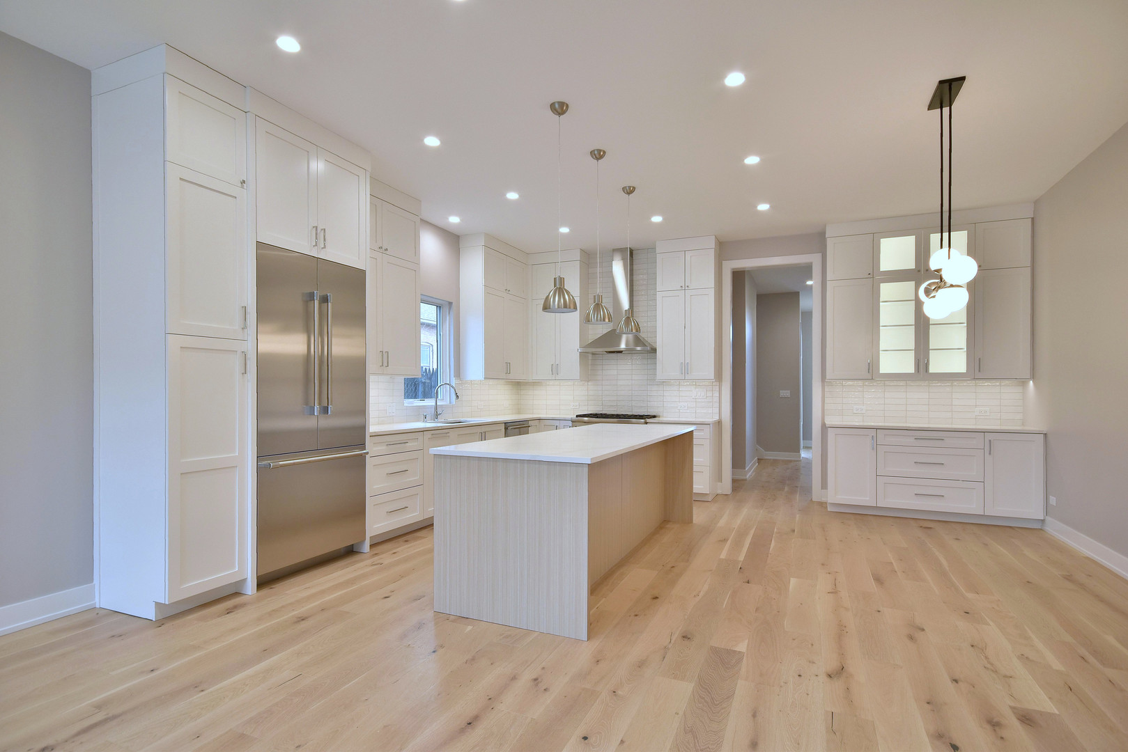 274 North Addison Avenue Elmhurst, IL 60126 - Photo 3 of 57 a large kitchen with stainless steel appliances granite countertop a large counter top a sink a refrigerator and a window