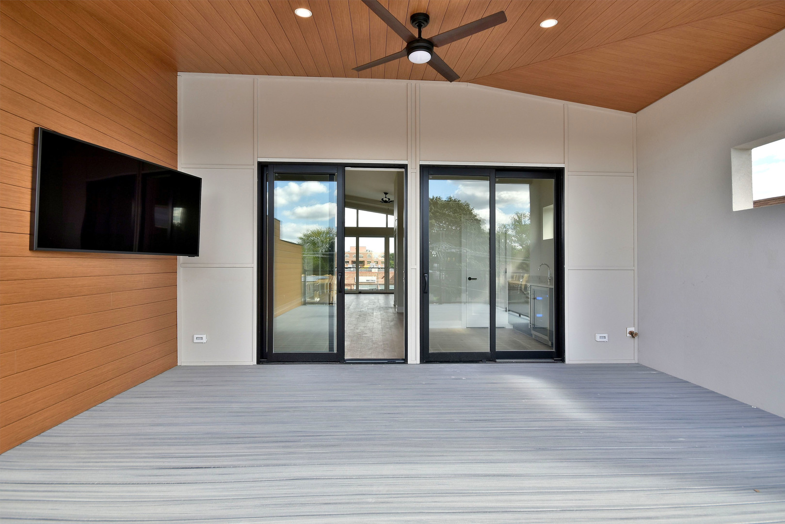 274 North Addison Avenue Elmhurst, IL 60126 - Photo 38 of 57 a view of a livingroom with wooden floor and a ceiling fan