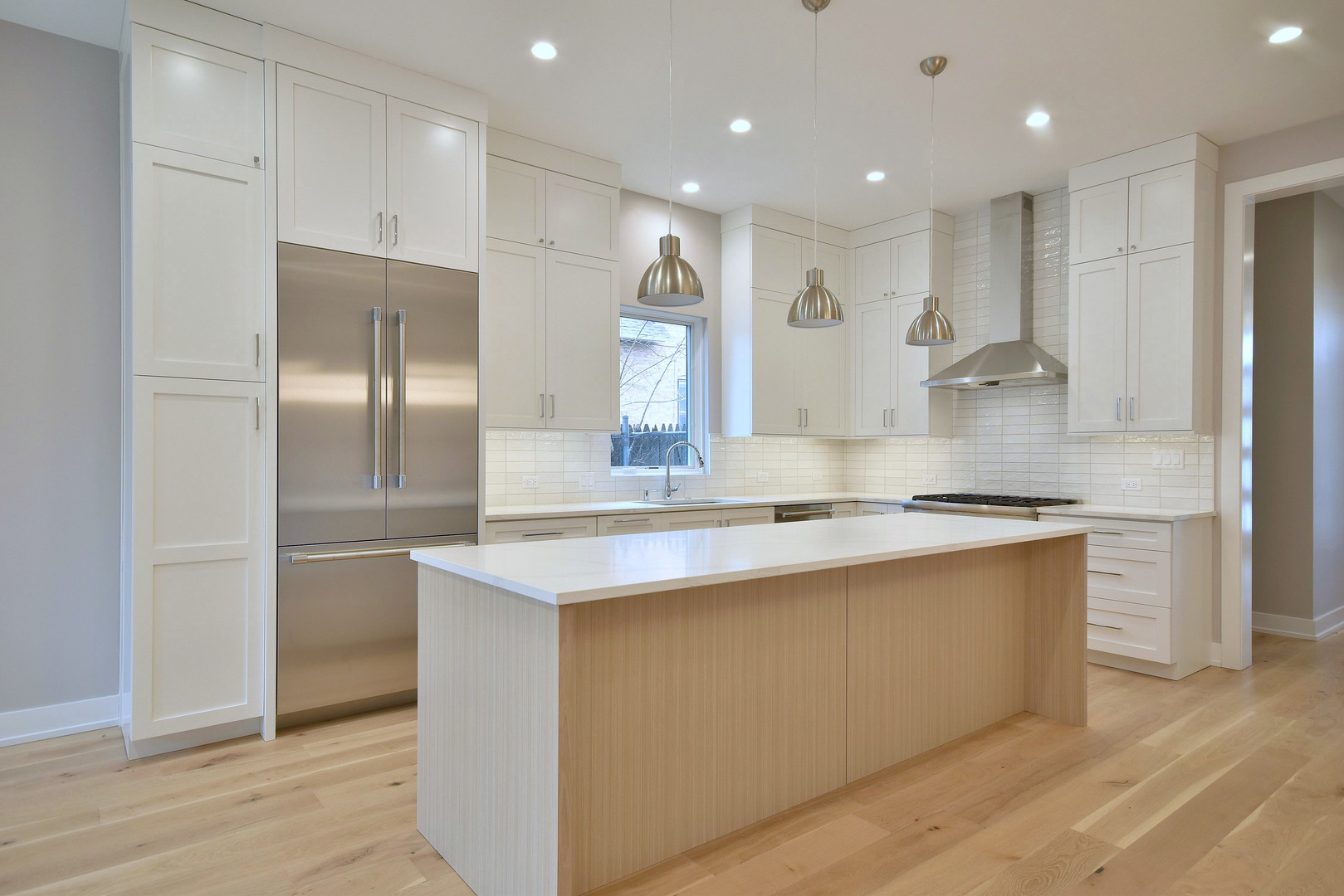 274 North Addison Avenue Elmhurst, IL 60126 - Photo 4 of 57 a large kitchen with stainless steel appliances granite countertop a large counter top a sink and a refrigerator