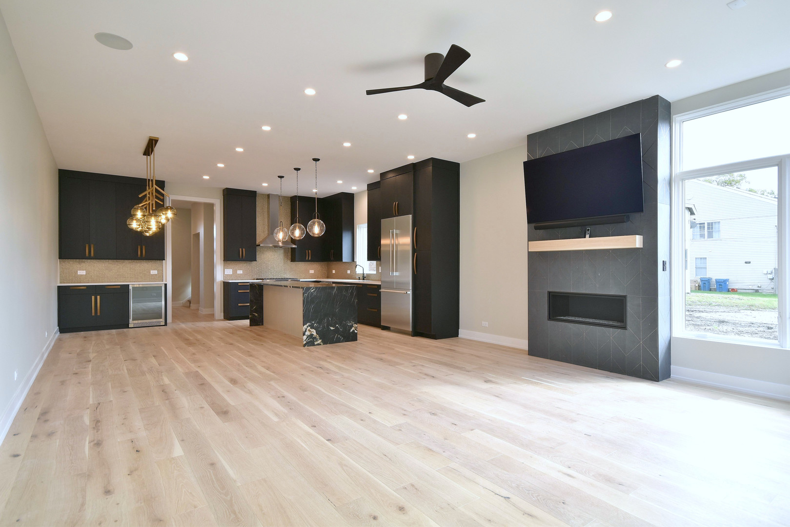 274 North Addison Avenue Elmhurst, IL 60126 - Photo 43 of 57 a large kitchen with stainless steel appliances kitchen island a large counter top a refrigerator and a sink