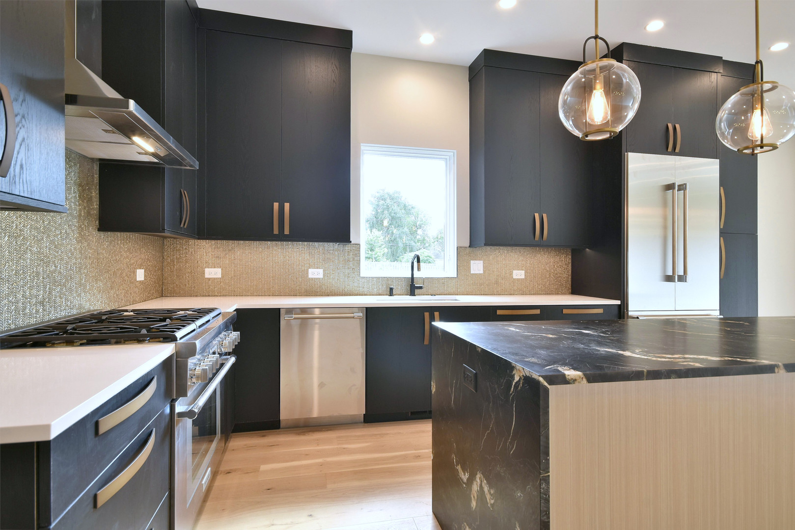 274 North Addison Avenue Elmhurst, IL 60126 - Photo 44 of 57 a kitchen with stainless steel appliances granite countertop a sink a stove and a microwave oven