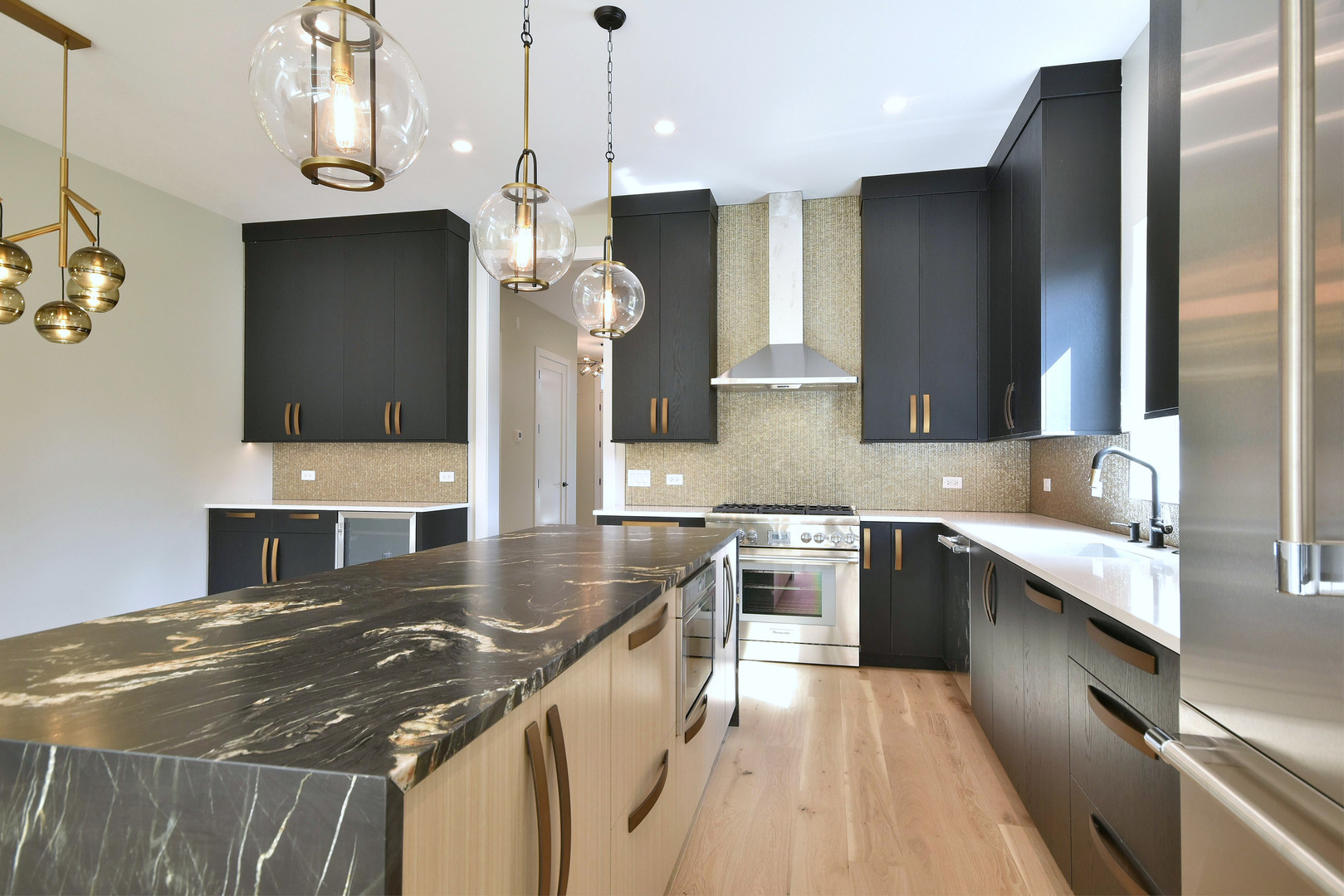 274 North Addison Avenue Elmhurst, IL 60126 - Photo 47 of 57 a kitchen with stainless steel appliances granite countertop a sink a stove and a wooden floor