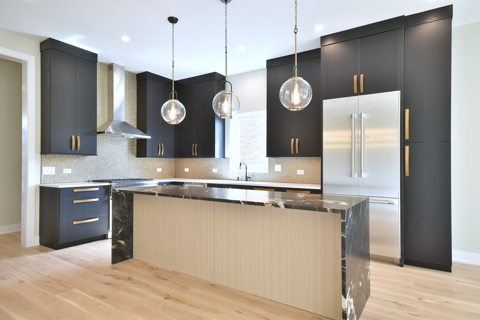 274 North Addison Avenue Elmhurst, IL 60126 - Photo 49 of 57 a kitchen with stainless steel appliances granite countertop a sink a stove and a refrigerator