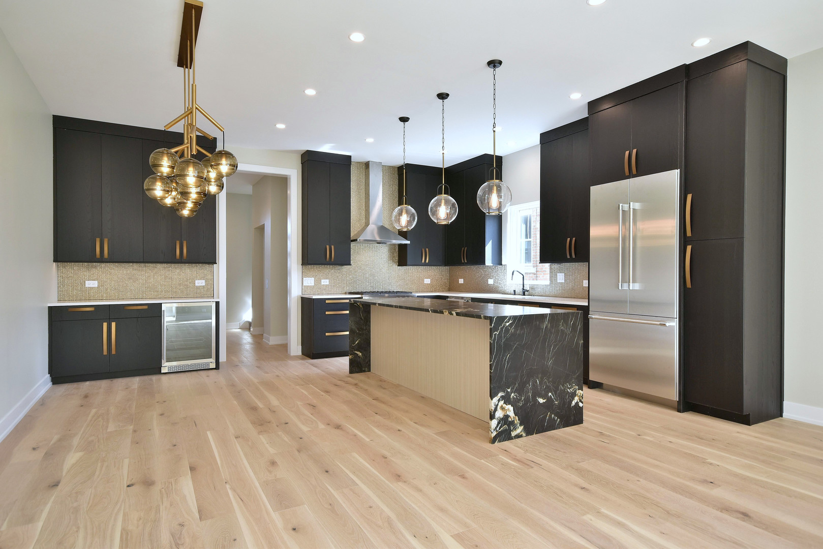 274 North Addison Avenue Elmhurst, IL 60126 - Photo 50 of 57 a kitchen with stainless steel appliances kitchen island granite countertop a refrigerator a sink and a stove
