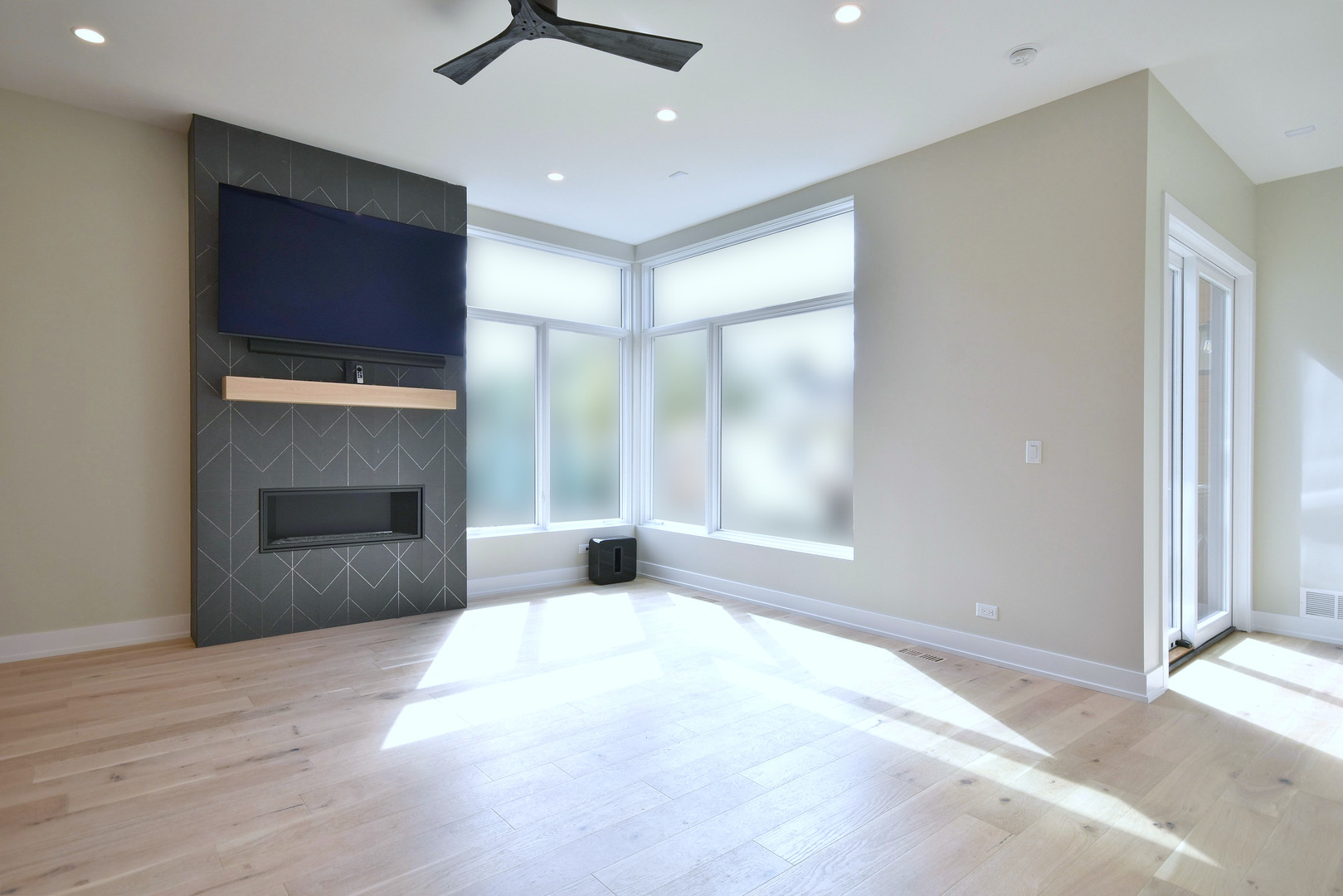 274 North Addison Avenue Elmhurst, IL 60126 - Photo 51 of 57 an empty room with a fireplace and windows