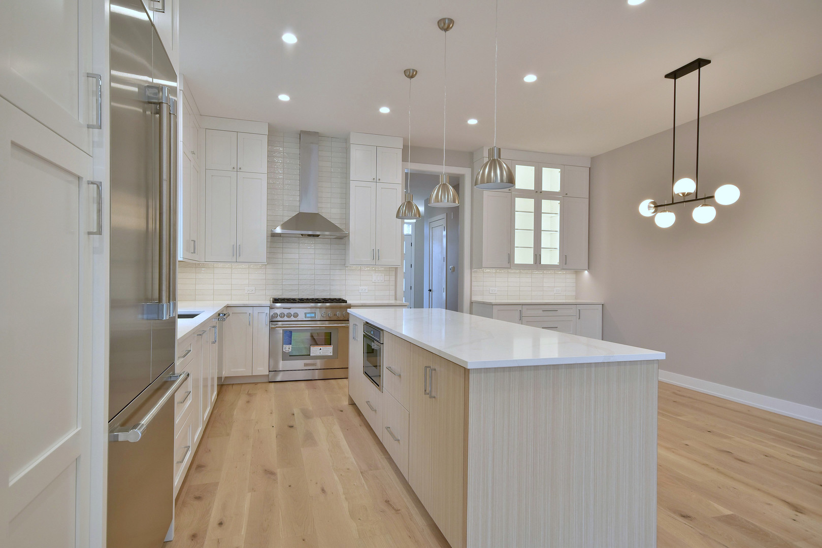 274 North Addison Avenue Elmhurst, IL 60126 - Photo 7 of 57 a kitchen with stainless steel appliances granite countertop a sink stove and refrigerator