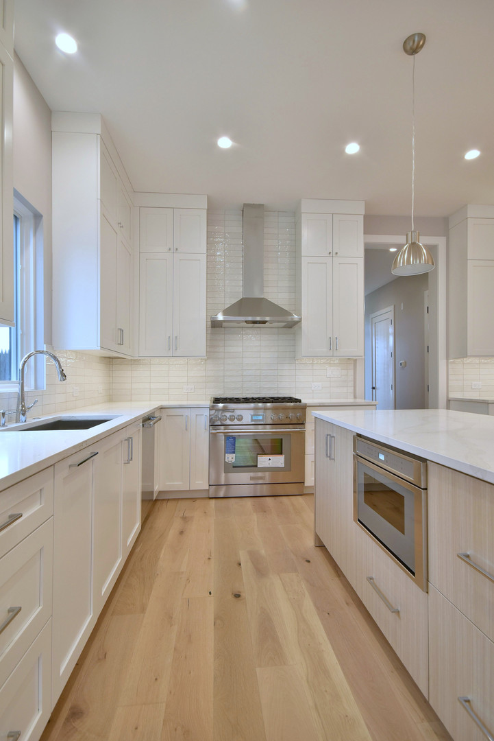 274 North Addison Avenue Elmhurst, IL 60126 - Photo 9 of 57 a kitchen with kitchen island sink stove and cabinets