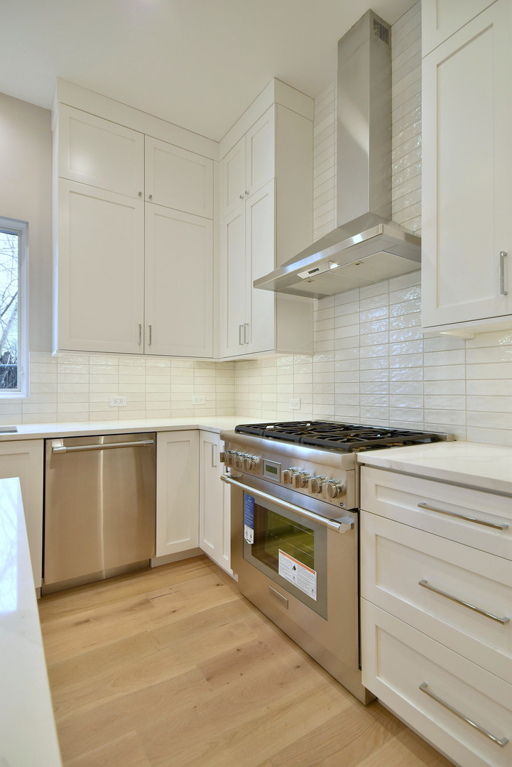 274 North Addison Avenue Elmhurst, IL 60126 - Photo 10 of 57 a kitchen with a stove top oven and cabinets