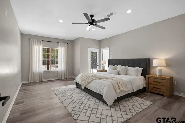 a bedroom with a bed and window