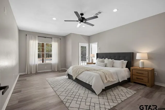 a bedroom with a bed and window