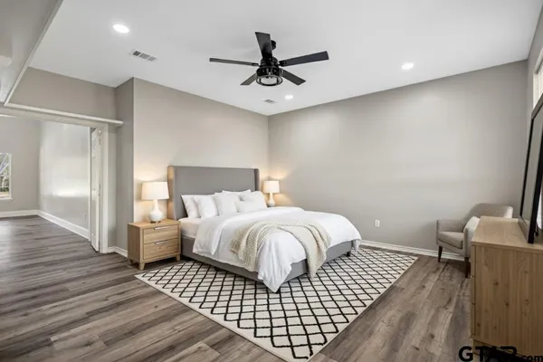 a bedroom with a bed and window