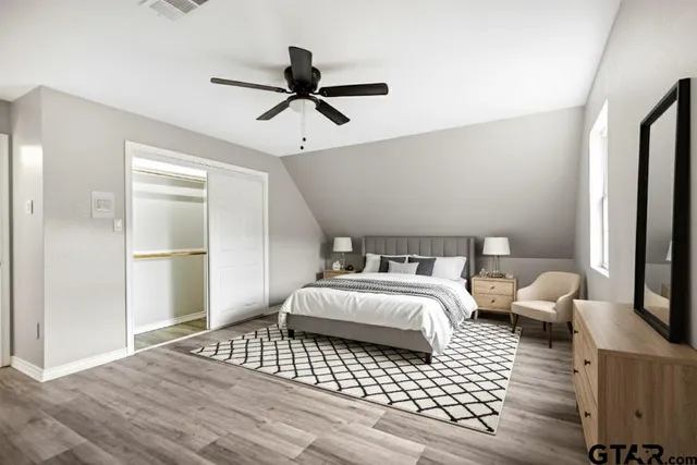 a bedroom with bed and window