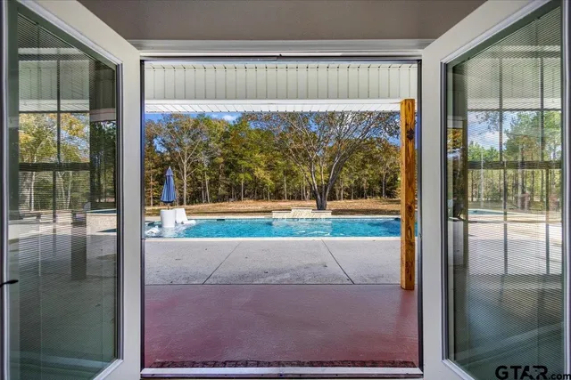 a view of a porch with a floor to ceiling window