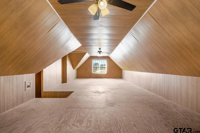 a view of swimming pool with large trees