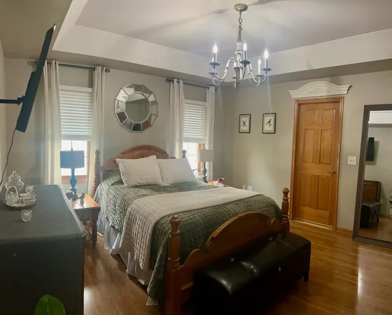 a bedroom with a bed and window