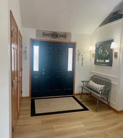 a view of an empty room with glass door