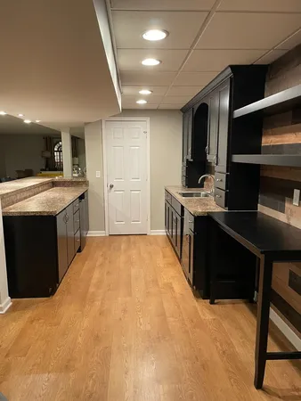 a kitchen with a stove and a refrigerator