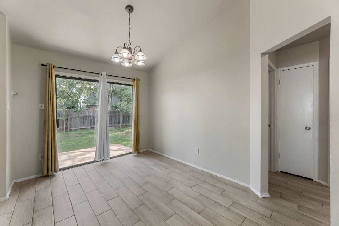 1808 Prairie Star Lane Round Rock, TX 78664 - Photo 11 of 32 a view of an empty room with glass door