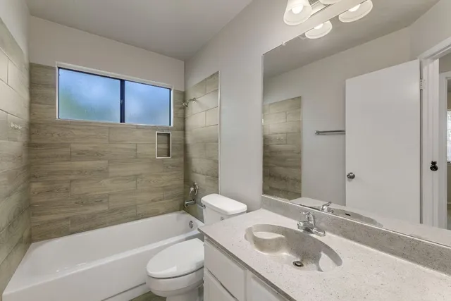 a kitchen with a sink and chandelier