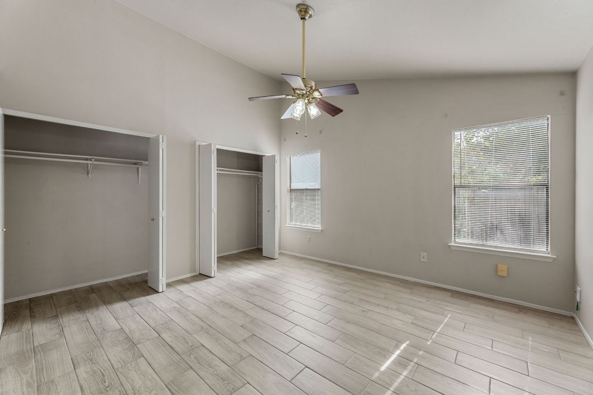 1808 Prairie Star Lane Round Rock, TX 78664 - Photo 21 of 32 a view of an empty room with a window and wooden floor