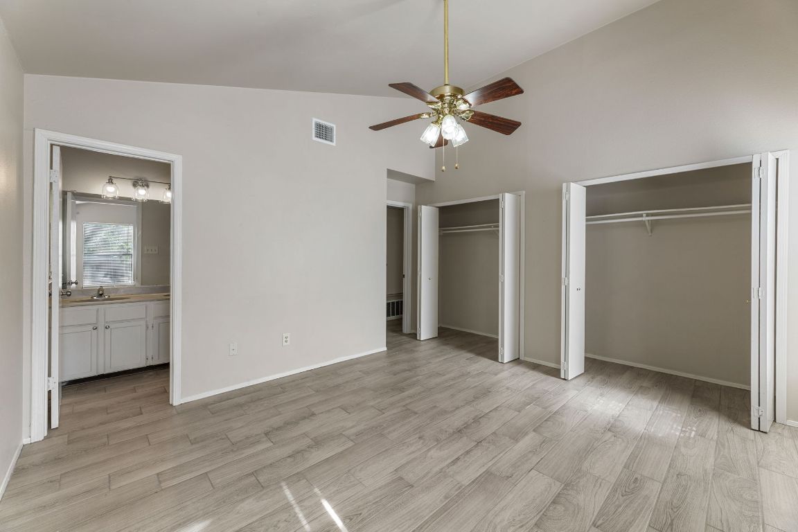 1808 Prairie Star Lane Round Rock, TX 78664 - Photo 22 of 32 a view of an empty room with window and wooden floor