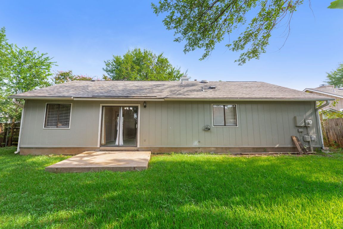 1808 Prairie Star Lane Round Rock, TX 78664 - Photo 28 of 32 a view of a backyard with a garden and plants