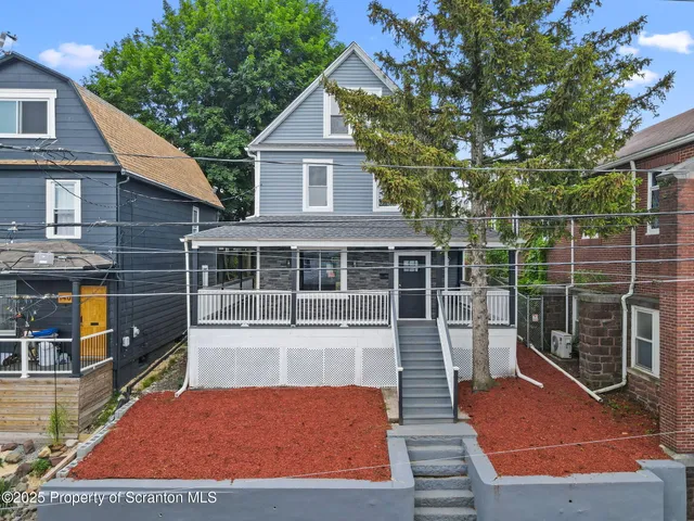 a view of front of house with a yard