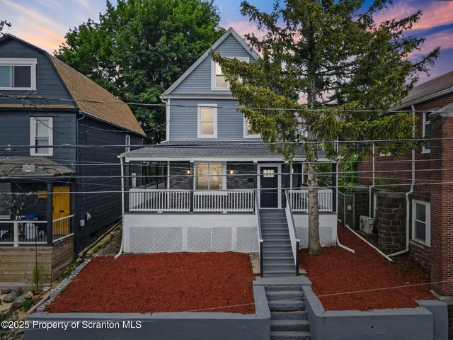 a view of house with backyard